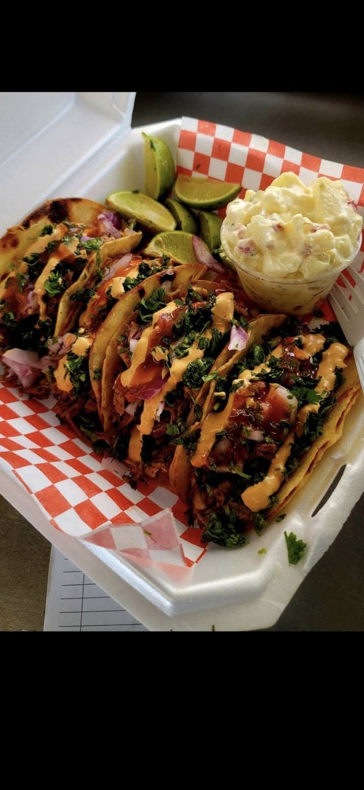 Tacos served with salsa and lime